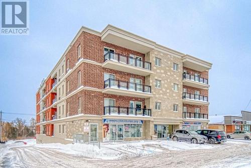 203 - 310 Broadway Avenue, Orangeville, ON - Outdoor With Balcony With Facade