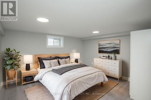 Virtually Staged - Lower Level Bedroom - 1 - 22 Prospect Street S, Hamilton, ON - Indoor Photo Showing Bedroom