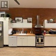 Sleek kitchen with butcher block - 