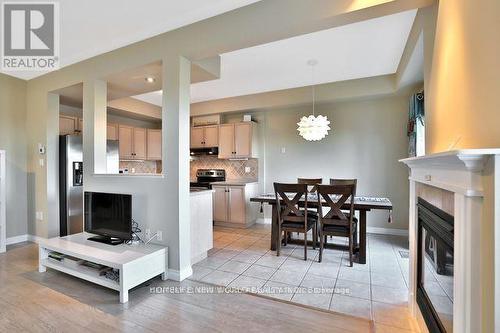 21 - 232 Stonehenge Drive, Hamilton, ON - Indoor With Fireplace