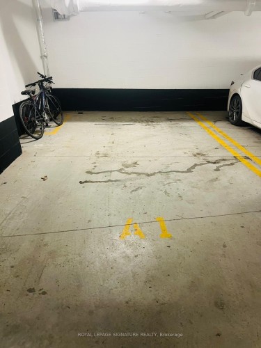 188 F-1608 Charles Street W, Whitby, ON - Indoor Photo Showing Garage