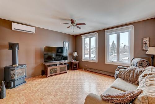 Salon - 176 Rue Berger, Saint-Constant, QC - Indoor Photo Showing Living Room With Fireplace