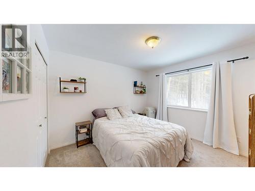 4983 Smith Road, 108 Mile Ranch, BC - Indoor Photo Showing Bedroom