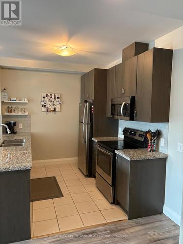 419 - 118 King Street E, Hamilton, ON - Indoor Photo Showing Kitchen With Double Sink