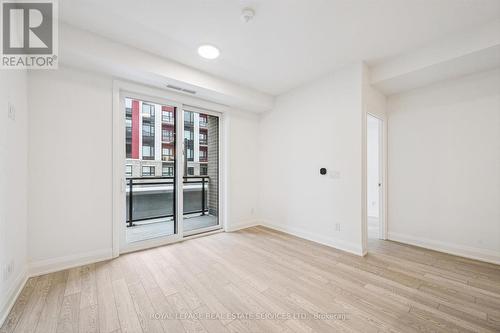 Living/Dining Area with Walkout to Private Balcony - 223 - 3250 Carding Mill Trail, Oakville, ON - Indoor Photo Showing Other Room