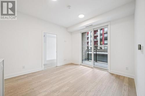 Living/Dining Area with Walkout to Private Balcony - 223 - 3250 Carding Mill Trail, Oakville, ON - Indoor Photo Showing Other Room