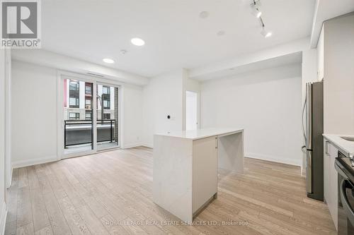 Bright, Open Concept Layout with Laminate Flooring - 223 - 3250 Carding Mill Trail, Oakville, ON - Indoor Photo Showing Kitchen