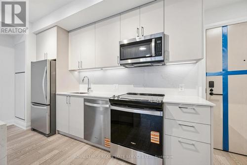 Contemporary Kitchen is both Functional & Elegant - 223 - 3250 Carding Mill Trail, Oakville, ON - Indoor Photo Showing Kitchen With Stainless Steel Kitchen
