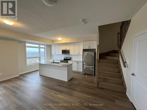 416 - 1577 Rose Way, Milton, ON - Indoor Photo Showing Kitchen With Stainless Steel Kitchen