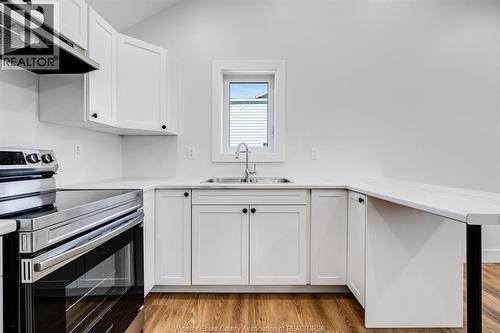 21 Pearl Street West Unit# 4, Kingsville, ON - Indoor Photo Showing Kitchen With Double Sink