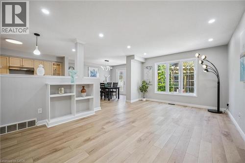 Unfurnished living room featuring recessed lighting and light wood-style floors - 723 Black Cherry Street, Waterloo, ON - Indoor