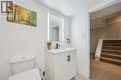 Half bath with vanity and toilet - 