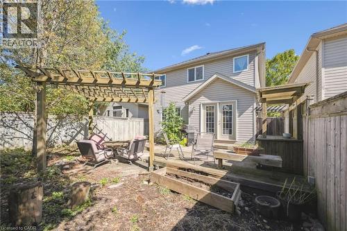 Rear view of property with a fenced backyard, a wooden deck, french doors, and a pergola - 723 Black Cherry Street, Waterloo, ON - Outdoor With Deck Patio Veranda