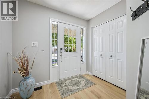 Entrance foyer with light wood-type flooring and baseboards - 723 Black Cherry Street, Waterloo, ON - Indoor Photo Showing Other Room