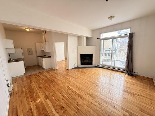 Living room - 410-2000 Av. Northcliffe, Montréal (Côte-Des-Neiges/Notre-Dame-De-Grâce), QC - Indoor With Fireplace