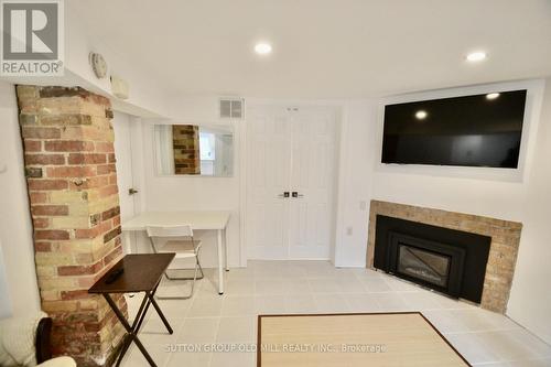 Lower - 180 Madison Avenue, Toronto, ON - Indoor Photo Showing Living Room With Fireplace