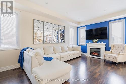 12 Hutton Crescent, Essa, ON - Indoor Photo Showing Living Room With Fireplace