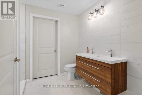Main bath leads to laundry area - 6 - 30 Prestige Circle, Ottawa, ON - Indoor Photo Showing Bathroom