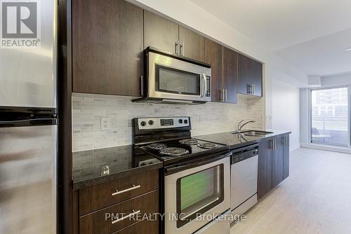 319 - 1 De Boers Drive, Toronto, ON - Indoor Photo Showing Kitchen With Stainless Steel Kitchen With Double Sink With Upgraded Kitchen