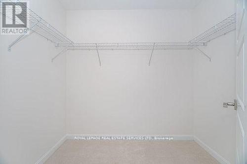 Walk-In Closet - 310 - 3028 Creekshore Common, Oakville, ON - Indoor With Storage