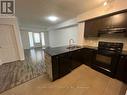 101 - 60 Baycliffe Crescent, Brampton, ON  - Indoor Photo Showing Kitchen With Double Sink 