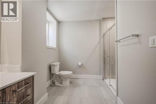 Professionally designed. Tiled shower with glass doors. - 28 Main Street Unit# 8, Cambridge, ON - Indoor Photo Showing Bathroom