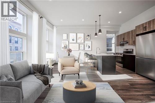 Open concept kitchen and living/dining room with windows overlooking Main Street. Stainless steel appliances including dishwasher and microwave. Extended quartz counter for breakfast bar. Virtually st - 28 Main Street Unit# 8, Cambridge, ON - Indoor Photo Showing Other Room