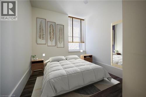 Luxury vinyl plank flooring and generous sized closet. Window overlooking The Galtway. Virtually staged. - 28 Main Street Unit# 8, Cambridge, ON - Indoor Photo Showing Bedroom