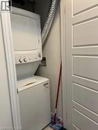 Laundry area featuring stacked washer / drying machine - 