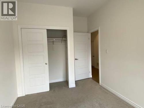 Unfurnished bedroom with carpet and a closet - 1430 Highland Road W Unit# 18 B, Kitchener, ON - Indoor Photo Showing Other Room