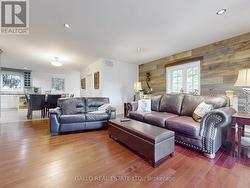 Spacious living room with cherry hardwood flooring - 