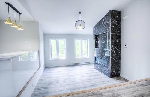 Living room - 1385 Ch. Des Hauteurs, Sainte-Adèle, QC - Indoor Photo Showing Other Room With Fireplace