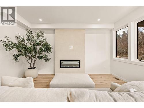 classic living area - 980 Bull Crescent, Kelowna, BC - Indoor With Fireplace