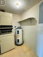 Laundry and storage off foyer - 