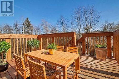 deck overlooks forest with creek - 37 Coldbrook Drive, Cavan Monaghan (Millbrook Village), ON - Outdoor With Deck Patio Veranda