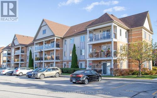 301 - 132 Aspen Springs Drive, Clarington (Bowmanville), ON - Outdoor With Balcony With Facade