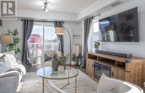 301 - 132 Aspen Springs Drive, Clarington (Bowmanville), ON - Indoor Photo Showing Living Room With Fireplace