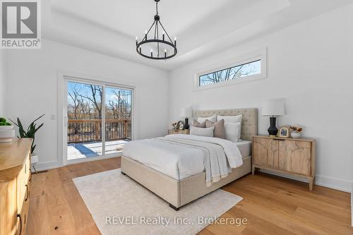 Primary bedroom with patio doors to deck - 752 Gorham Road, Fort Erie (Ridgeway), ON - Indoor Photo Showing Bedroom