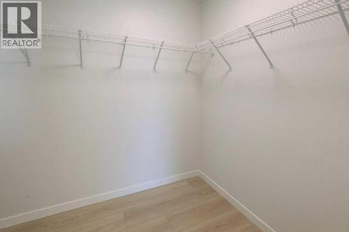 124, 245 Edith Place Nw, Calgary, AB - Indoor With Storage