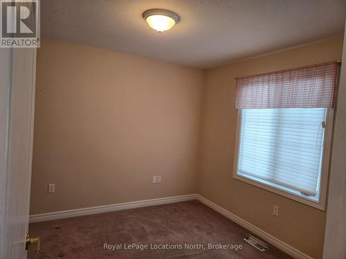 2nd bedroom with large window - Unit # 23 - 275 Huron Street, Clearview (Stayner), ON - Indoor Photo Showing Other Room