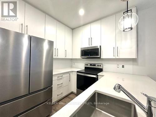 233 - 175 Doan Drive, Middlesex Centre, ON - Indoor Photo Showing Kitchen With Stainless Steel Kitchen