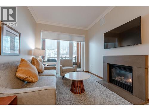 2950 Camozzi Road Unit# 1303, Revelstoke, BC - Indoor Photo Showing Living Room With Fireplace