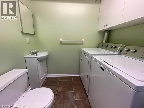 Half bath with vanity and washing machine and clothes dryer - 214 Benesfort Crescent, Kitchener, ON - Indoor