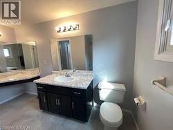 Bathroom featuring vanity and toilet - 