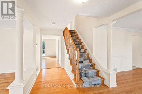 Oak Hardwood & Staircase with Carpet Runner - 99 Queensline Drive, Ottawa, ON - Indoor Photo Showing Other Room