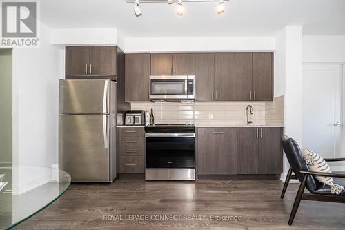 718 - 2550 Simcoe Street N, Oshawa, ON - Indoor Photo Showing Kitchen With Stainless Steel Kitchen
