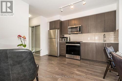 718 - 2550 Simcoe Street N, Oshawa, ON - Indoor Photo Showing Kitchen With Stainless Steel Kitchen