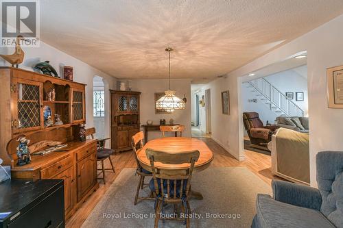 166 Duck Bay Road, Tay, ON - Indoor Photo Showing Dining Room With Fireplace