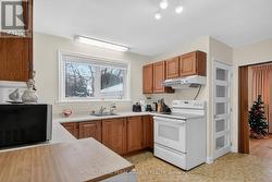 Kitchen, door to basement & rear yard access to DR - 