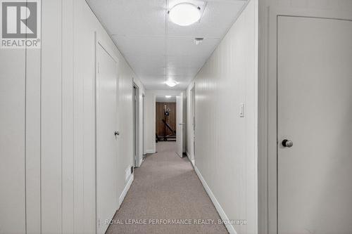 Hallway with 2 closets, door to laundry room - 19 Mowat Street, Ottawa, ON - Indoor Photo Showing Other Room